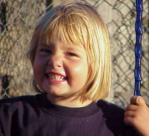 Em on swing.jpg (26460 bytes)